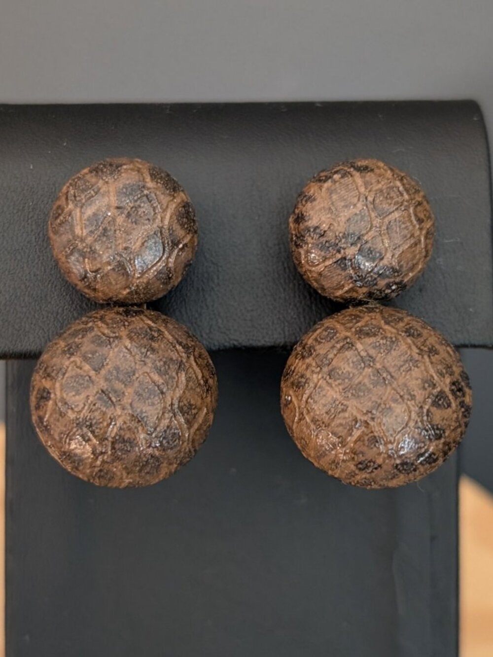 Double snake embossed leather bead clip on earrings